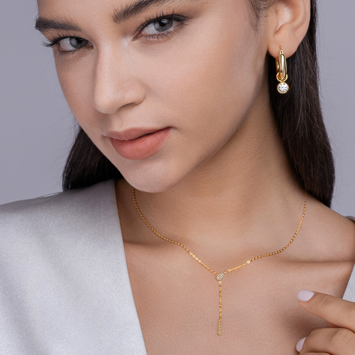 Moissanite earrings paired with ethnic-style clothing